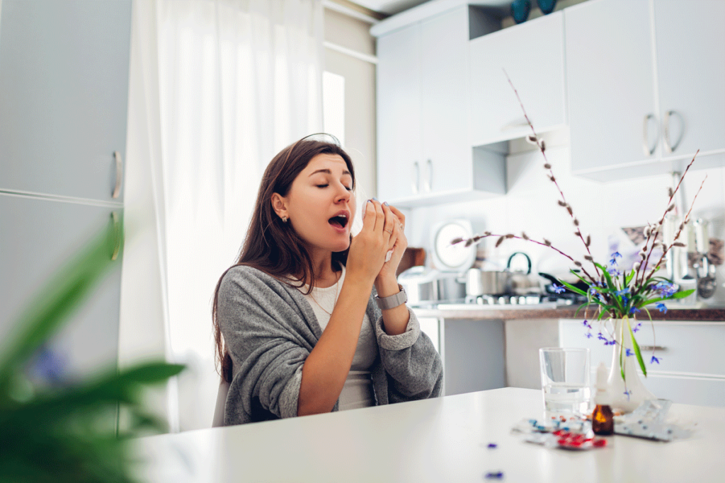 Spring Allergies - Woman sneezing